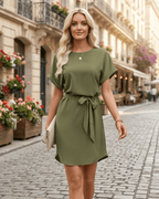 Elara Mini Dress in olive green with smooth woven fabric, round neckline, self-tie waist belt by Lauven.