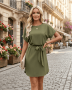 Elara Mini Dress in olive green with self-tie waist belt, round neckline, featuring smooth woven fabric by Lauven.