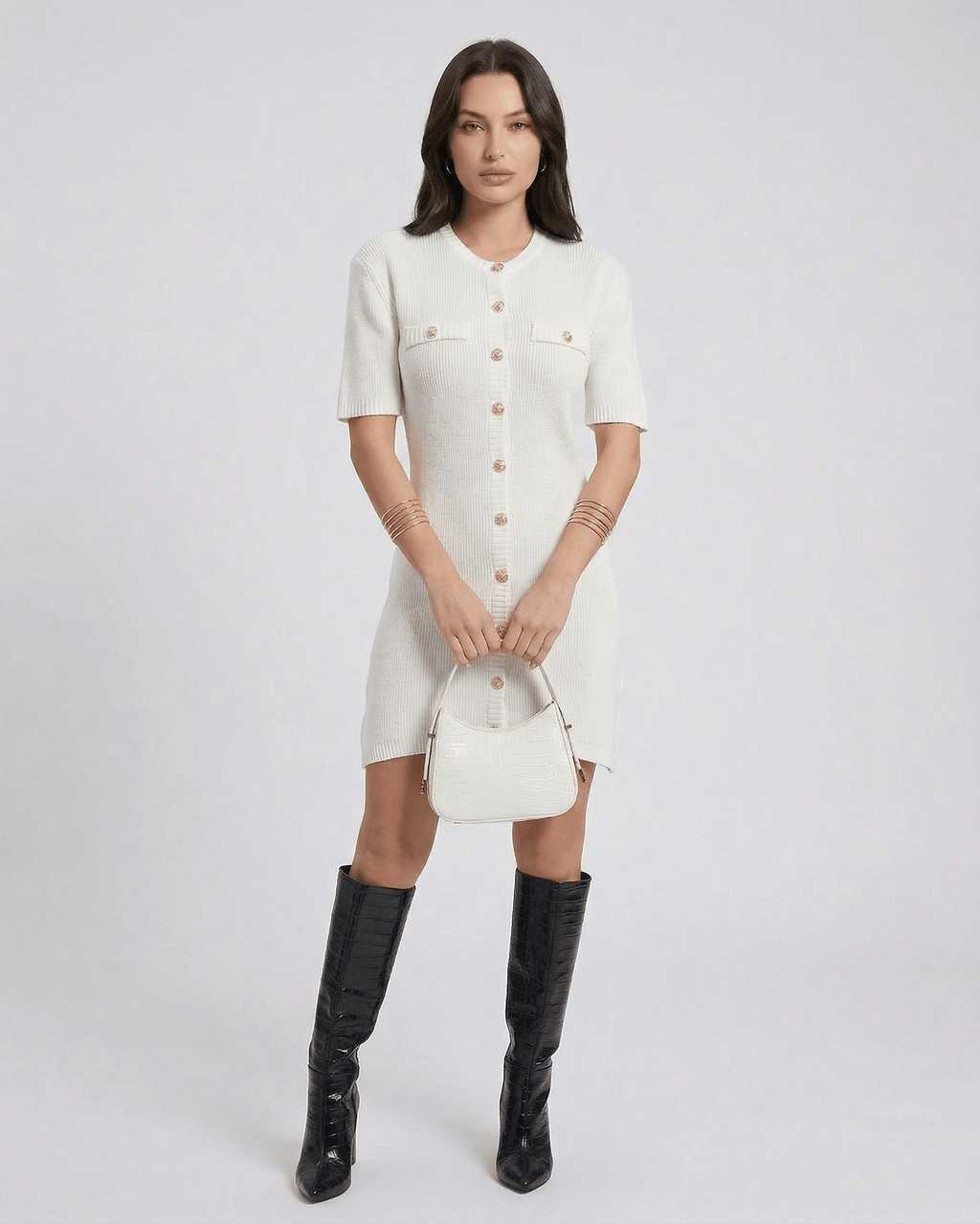Elysia Mini Dress by Lauven featuring a chic knit design and button closure, styled with knee-high boots and a handbag.