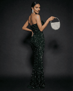Emerald Maxi Dress by Lauven, stunning strapless bow sequin maxi party dress shown from the side.