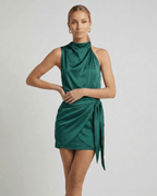 Emerald Mini Dress by Lauven, featuring a dark green satin fabric with draped high neck and wrap tie detail.