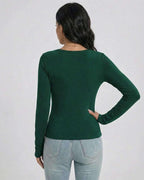 Back view of a woman wearing the Lauven Emerald Pullover, a green slim fit V-neck long sleeve sweater.