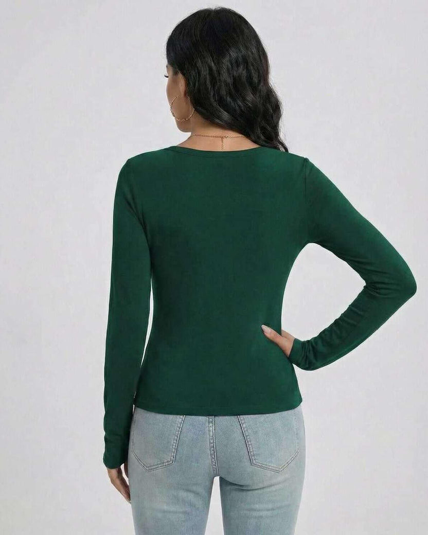 Back view of a woman wearing the Lauven Emerald Pullover, a green slim fit V-neck long sleeve sweater.