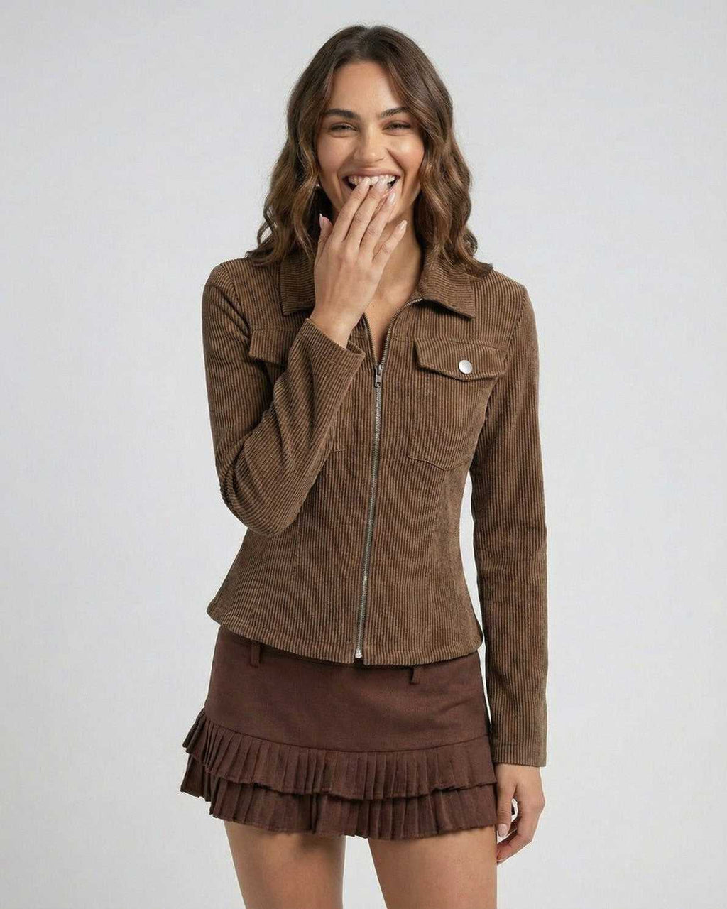 Woman wearing Lauven Florence Jacket, a brown corduroy zip-up jacket with a flattering fit
