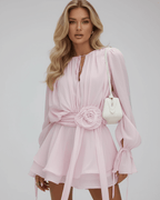 Florence Mini Dress by Lauven features 3D floral embellishments, flare sleeves, and a soft pink design.
