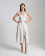 Elara Midi Dress by Lauven featuring elegant A-line silhouette and polka dot detail, perfect for refined femininity.