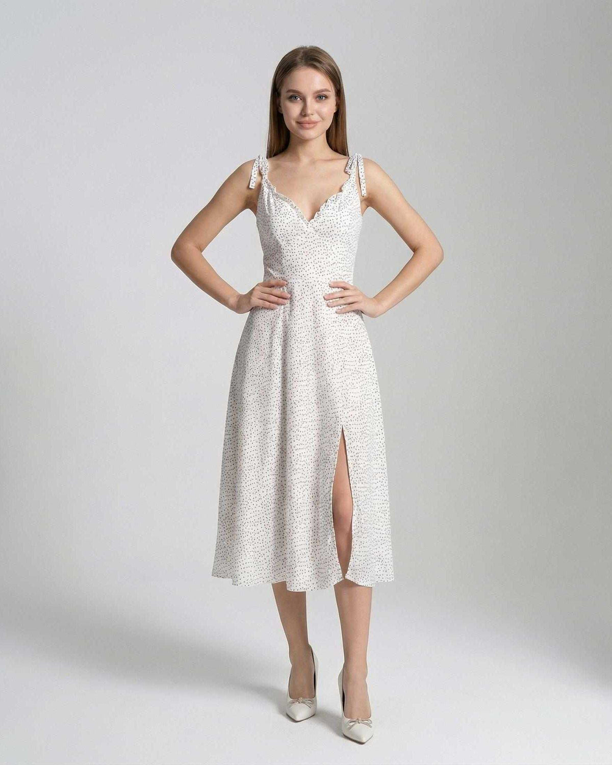 Elara Midi Dress by Lauven featuring elegant A-line silhouette and polka dot detail, perfect for refined femininity.