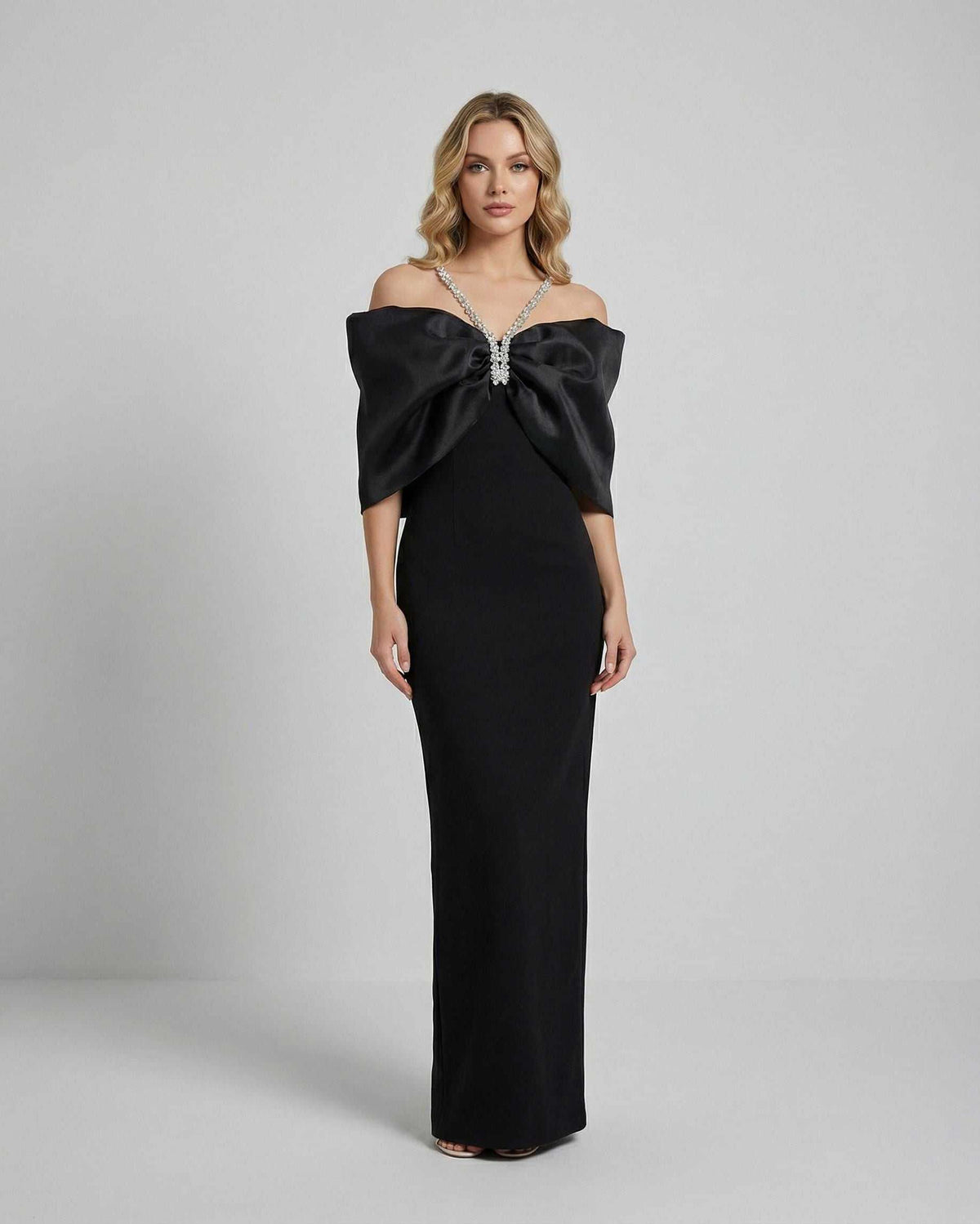 Celeste Maxi Dress by Lauven featuring an oversized bow and elegant off-shoulder design in luxurious black fabric.