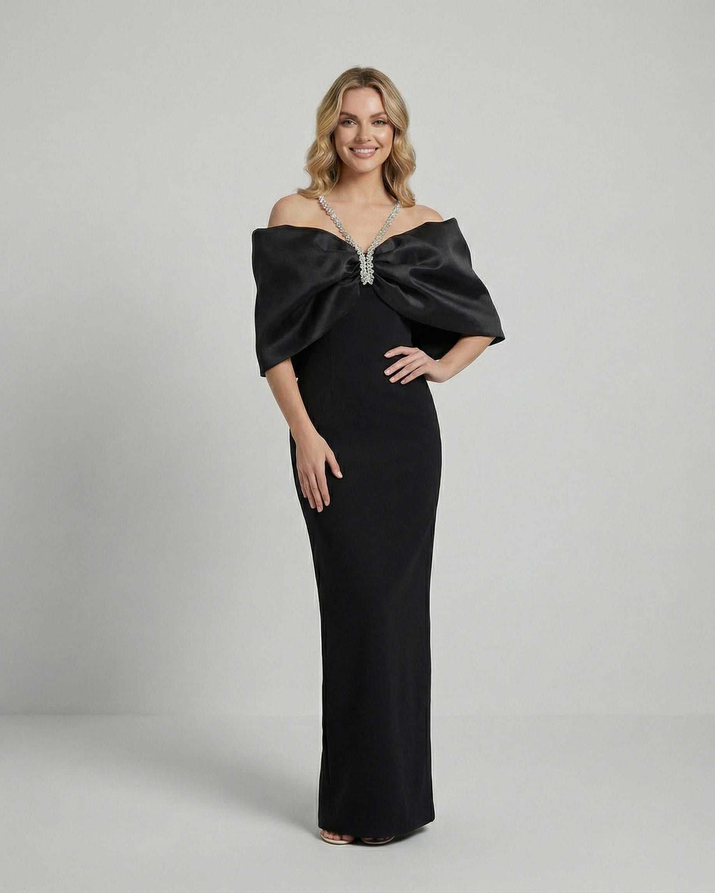 Lauven Celeste Maxi Dress featuring dramatic bow and elegant silhouette in black fabric.