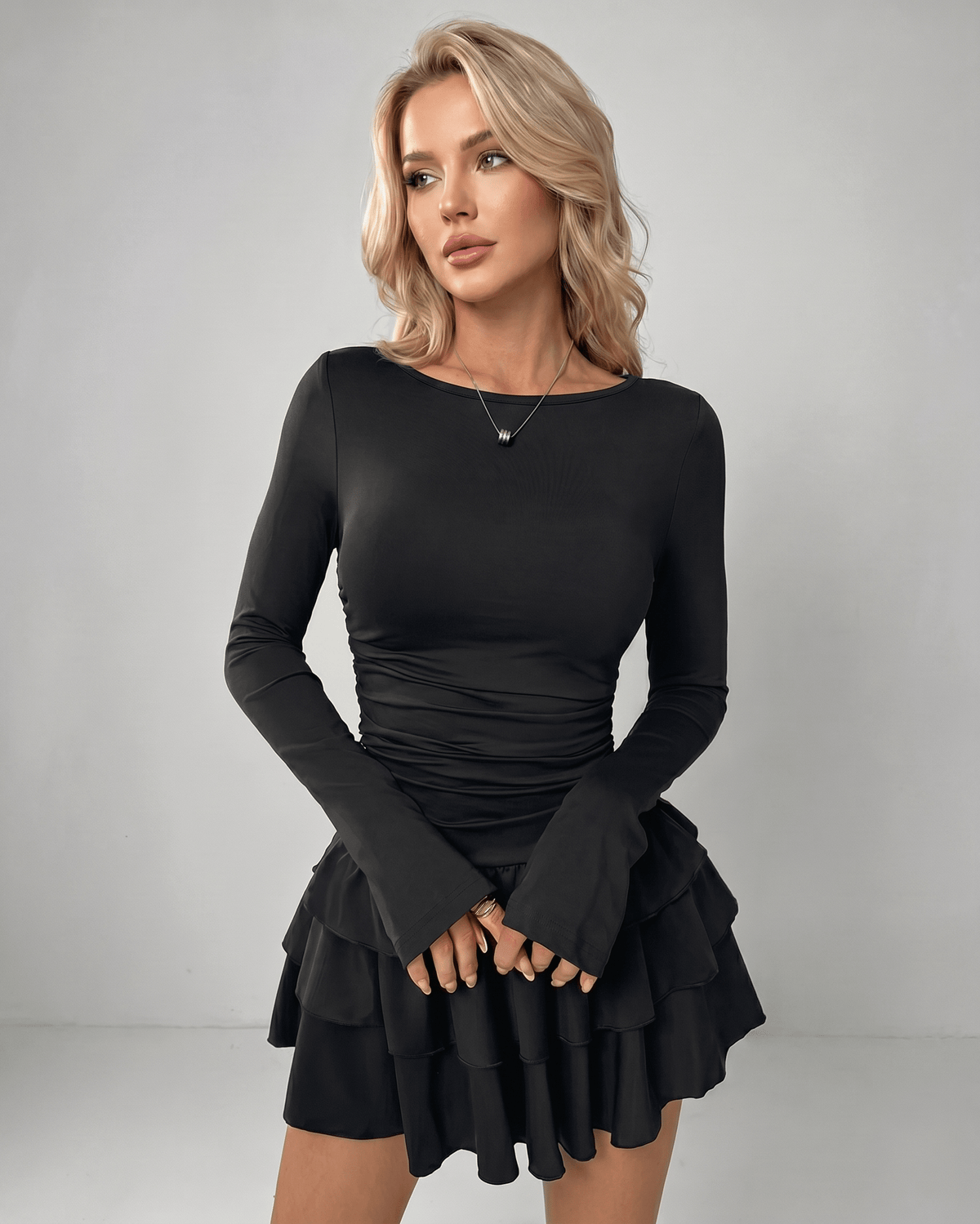 Aurevia Mini Dress by Lauven — black stretch long sleeve round neck fitted mini dress with ruffle hem