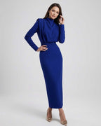 Lauven Indigo Midi Dress – Sleek trumpet silhouette with high stand neckline and full-length sleeves.