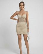 Isla Mini Dress by Lauven featuring a figure-flattering slim fit and bold cut-out details in a stylish beige color.