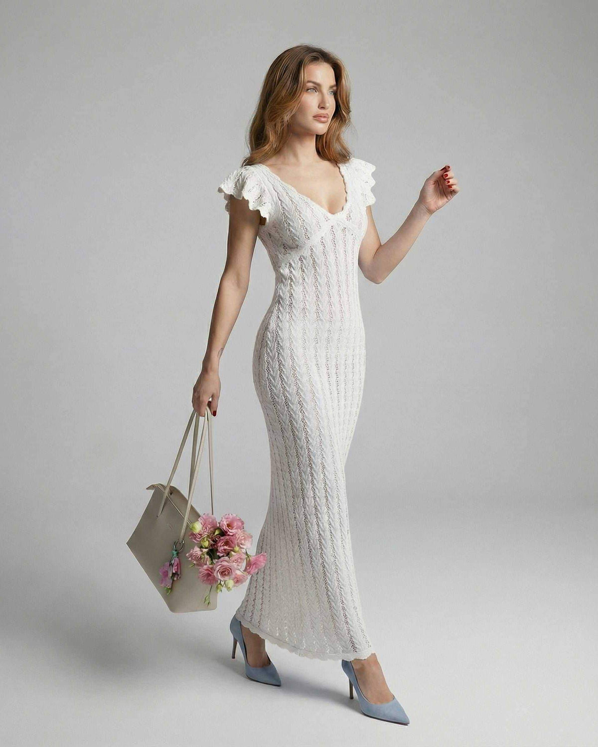 Ivory Lace Maxi dress by Lauven, featuring a V-neckline and ruffle sleeves in a textured white lace design.