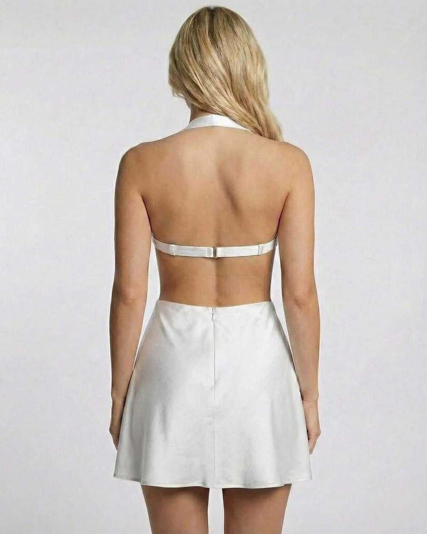 Back view of Ivory Mini Dress by Lauven with halter neck and cut-out design, showcasing sleek satin fabric.