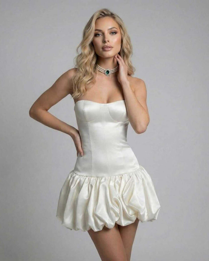 Elegant Lauven Ivory Mini Dress featuring a strapless bodycon silhouette and playful puffed skirt.