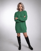 Model wearing Ivy Mini Dress in Emerald Green Cable Knit by Lauven, showcasing a loose fit and ribbed trims.