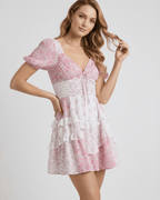 Ivy Mini Dress with floral print, puff sleeves, A-line silhouette by Lauven, features a deep V-neckline, comfortable and stylish.