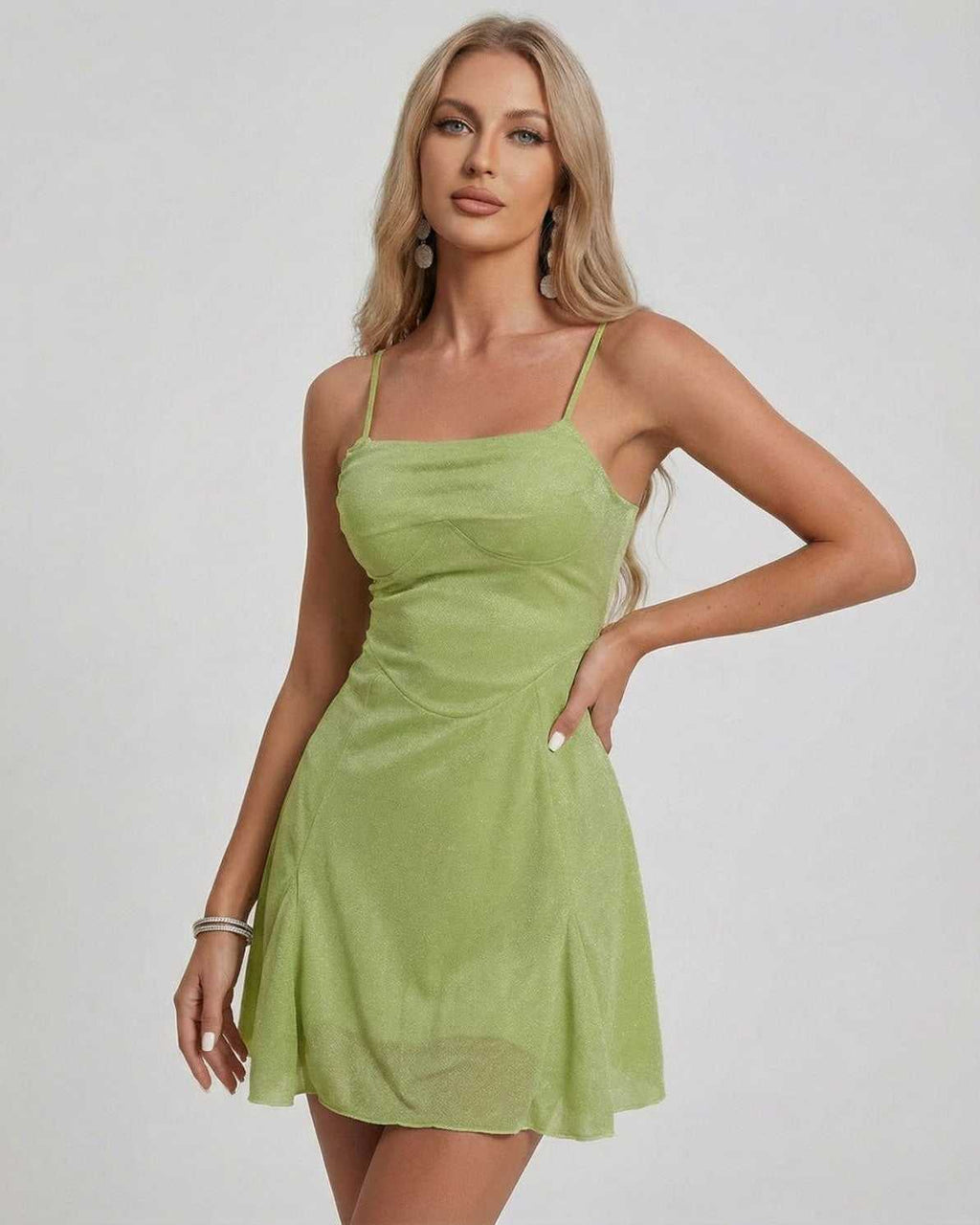 Ivy Mini Dress by Lauven, showcasing a shimmering green A-line silhouette with a square neckline.