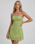 Ivy Mini Dress by Lauven, showcasing a shimmering green A-line silhouette with a square neckline.