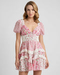 Ivy Mini Dress featuring pink floral print, A-line silhouette, puff sleeves, and elegant design by Lauven.