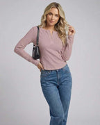 Arden Long Sleeve women’s long sleeve henley top in dusty rose color, featuring button placket and casual style.