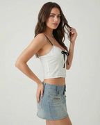 Arden Top by Lauven - White camisole with black bow detail, perfect for stylish summer outfits.