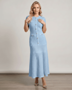 Aureline Maxi Dress in light blue knit, featuring a round neck, button details, and flared hem, by Lauven.