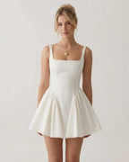 Aurora Mini Dress by Lauven, white square neck backless mini dress with bow detail and A-line shape.