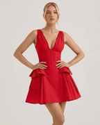 Aurora Mini Dress by Lauven in red, showcasing a plunging V-neckline and playful pouf skirt.