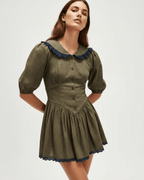 Aveline Mini Dress by Lauven featuring Peter Pan collar and puff sleeves in olive green with navy accents.