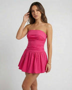 Azalea Mini Dress by Lauven in vibrant pink, strapless A-line silhouette perfect for summer parties.