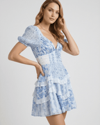 Azure Mini Dress by Lauven, features blue floral print, tiered ruffles, and elegant A-line fit for refreshing style.