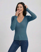 Model wearing the Azure Pullover by Lauven, a women’s V-neck pullover sweater in a flattering slim fit.