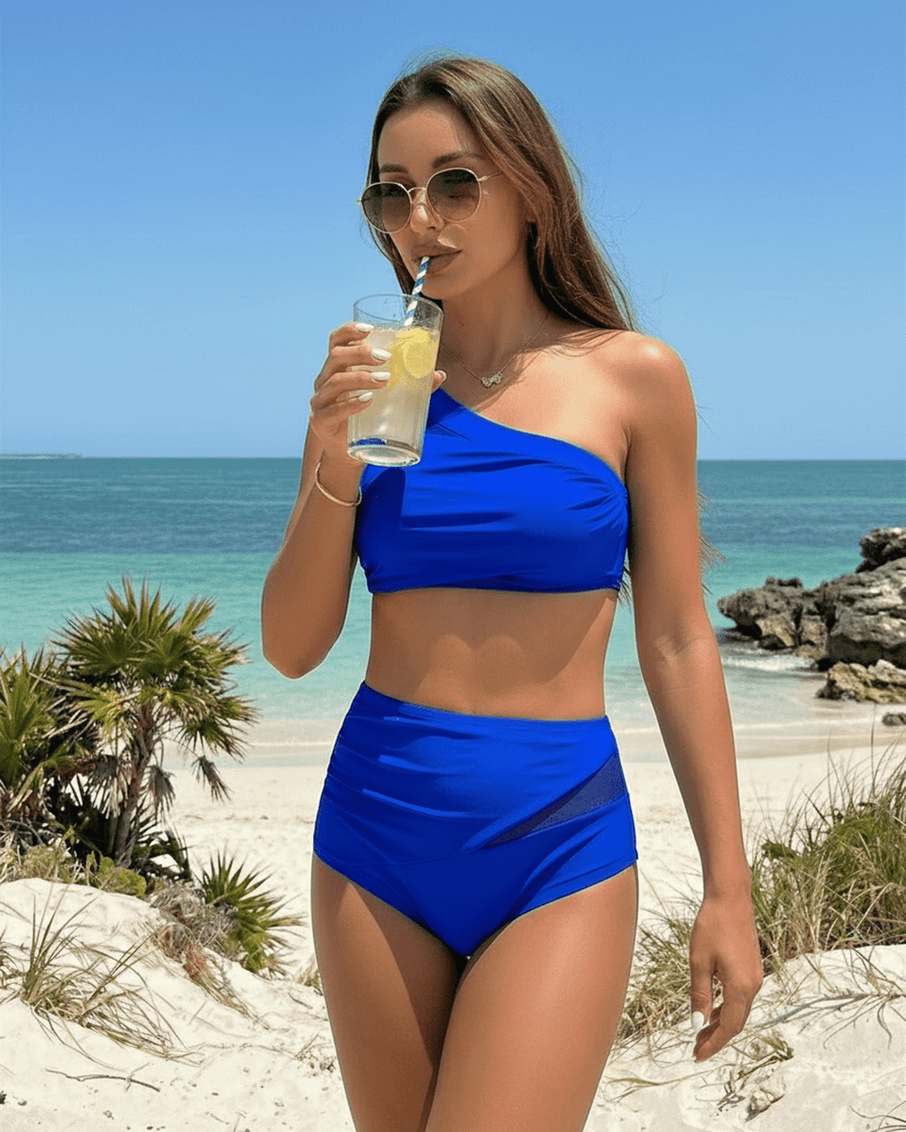 Azure Two-Piece Swimsuit by Lauven featuring a vibrant blue tone and asymmetric design, perfect for beach outings.