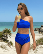 Azure Two-Piece Swimsuit by Lauven featuring a vibrant blue tone and asymmetric design, perfect for beach outings.