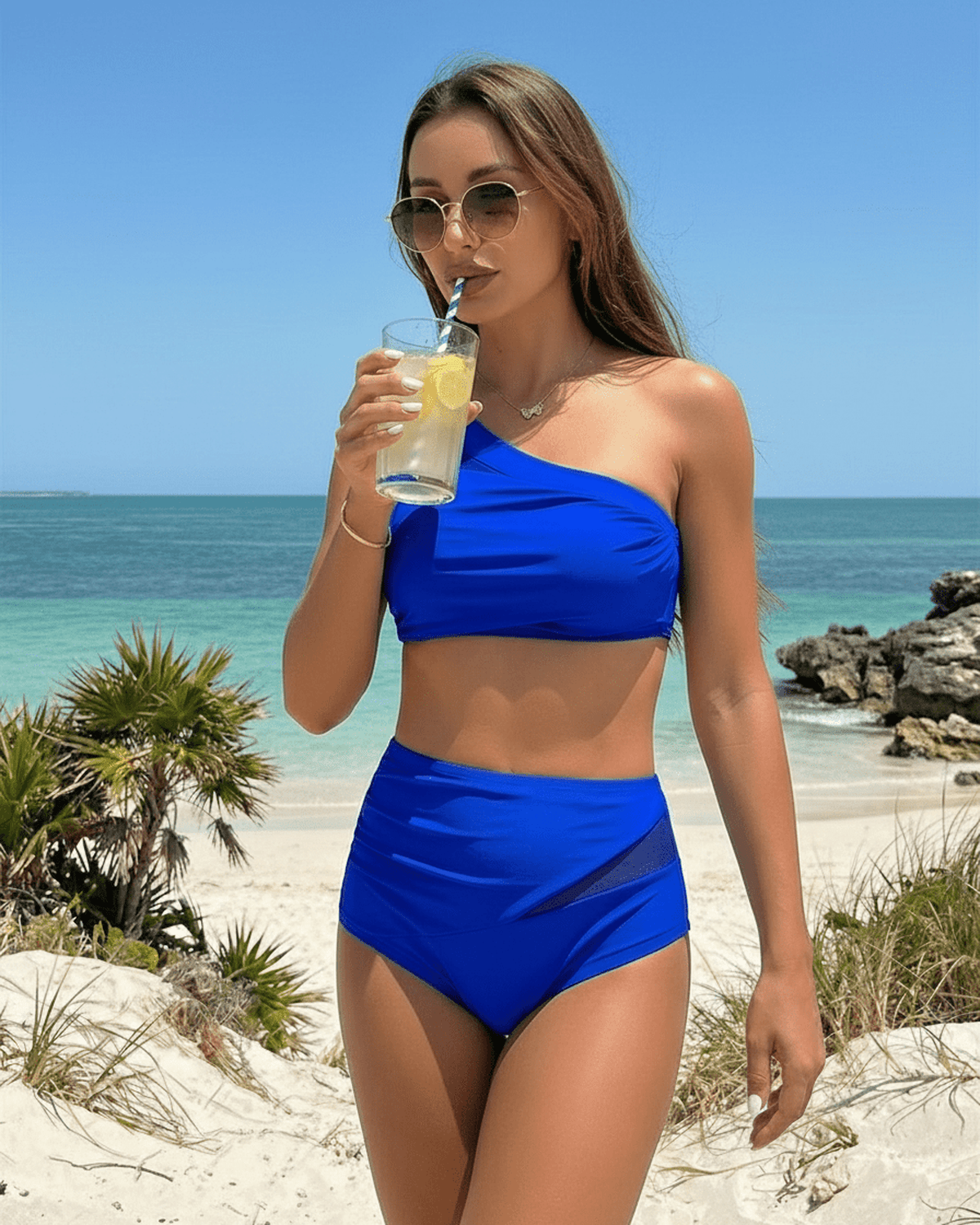 Azure Two-Piece Swimsuit by Lauven featuring a vibrant blue tone and asymmetric design, perfect for beach outings.