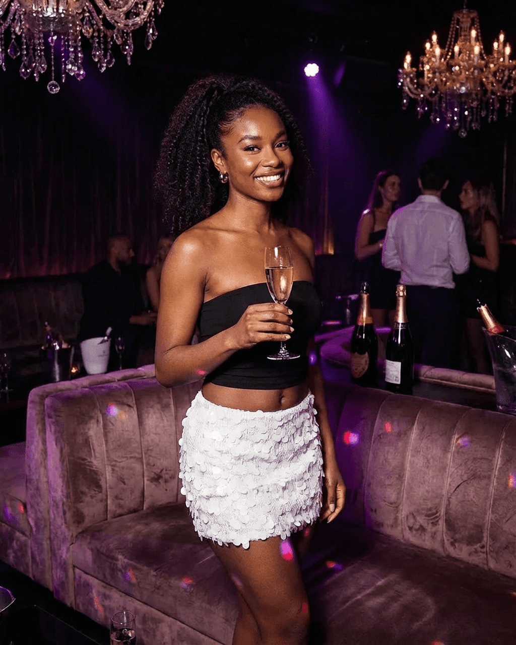 Bianca Mini Skirt by Lauven, white sequin A-line bodycon mini skirt worn at a glamorous party.