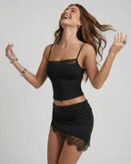 Model wearing Lauven Vega Mini Dress, a sexy club sheath dress with black lace details and a stylish silhouette.