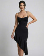 Elegant black Nova Midi Dress by Lauven featuring asymmetrical hemline and slim fit, perfect for evening events.