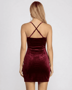 Back view of the elegant Bordeaux Mini Dress by Lauven, showcasing its velvet fabric and crisscross straps.