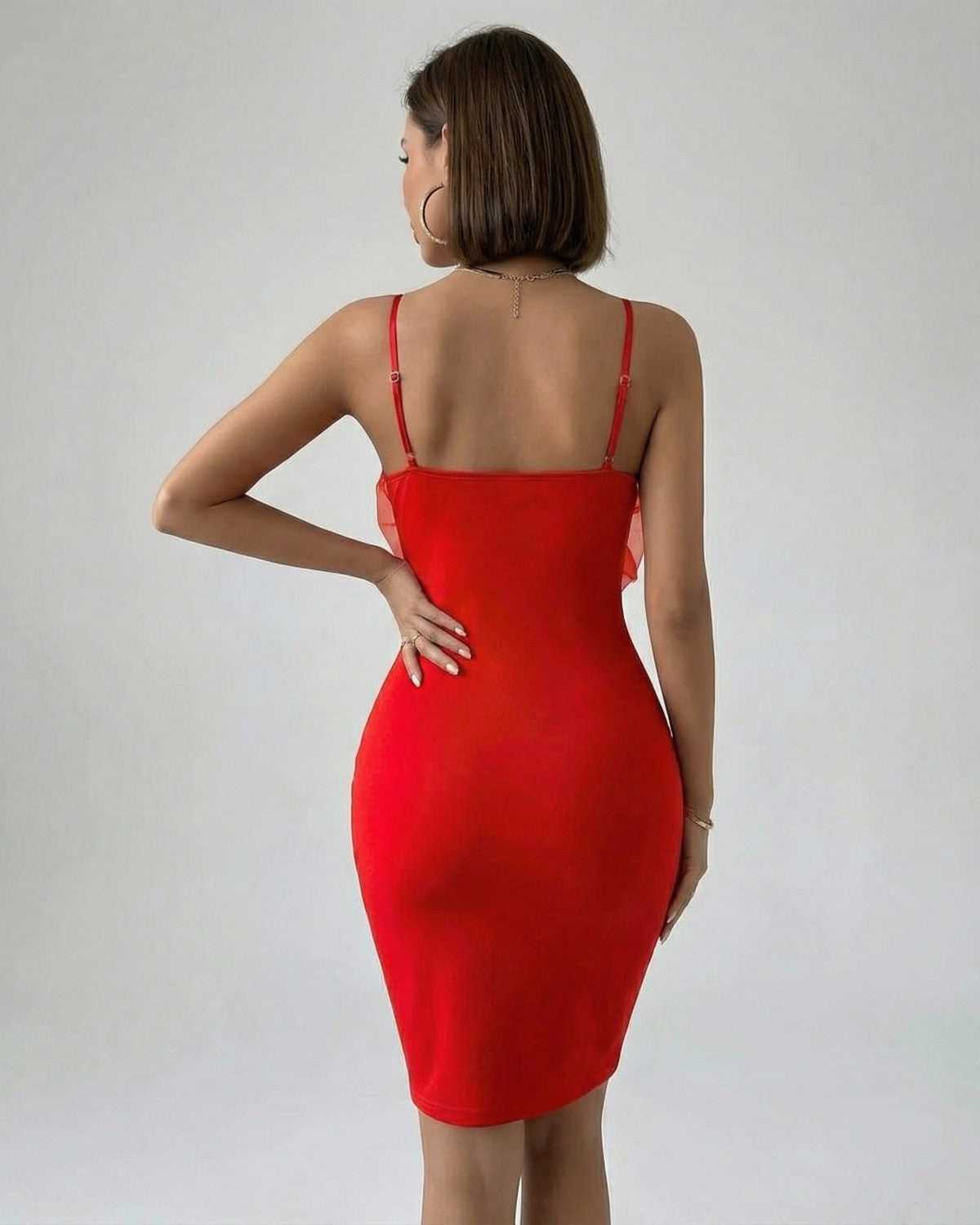Back view of a model wearing the Camellia Mini Dress by Lauven, showcasing its sleek red sheath design.