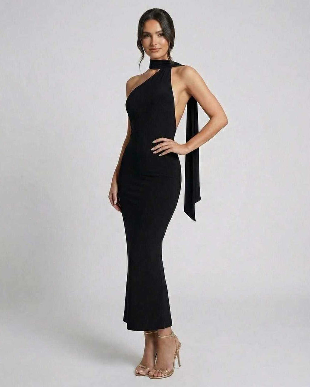 Celeste Maxi Dress by Lauven: Sleek black halter neck evening dress with a modern silhouette.