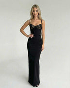 Celeste Maxi Dress by Lauven featuring a lace bodice detail, sleek black design, and form-fitting silhouette.