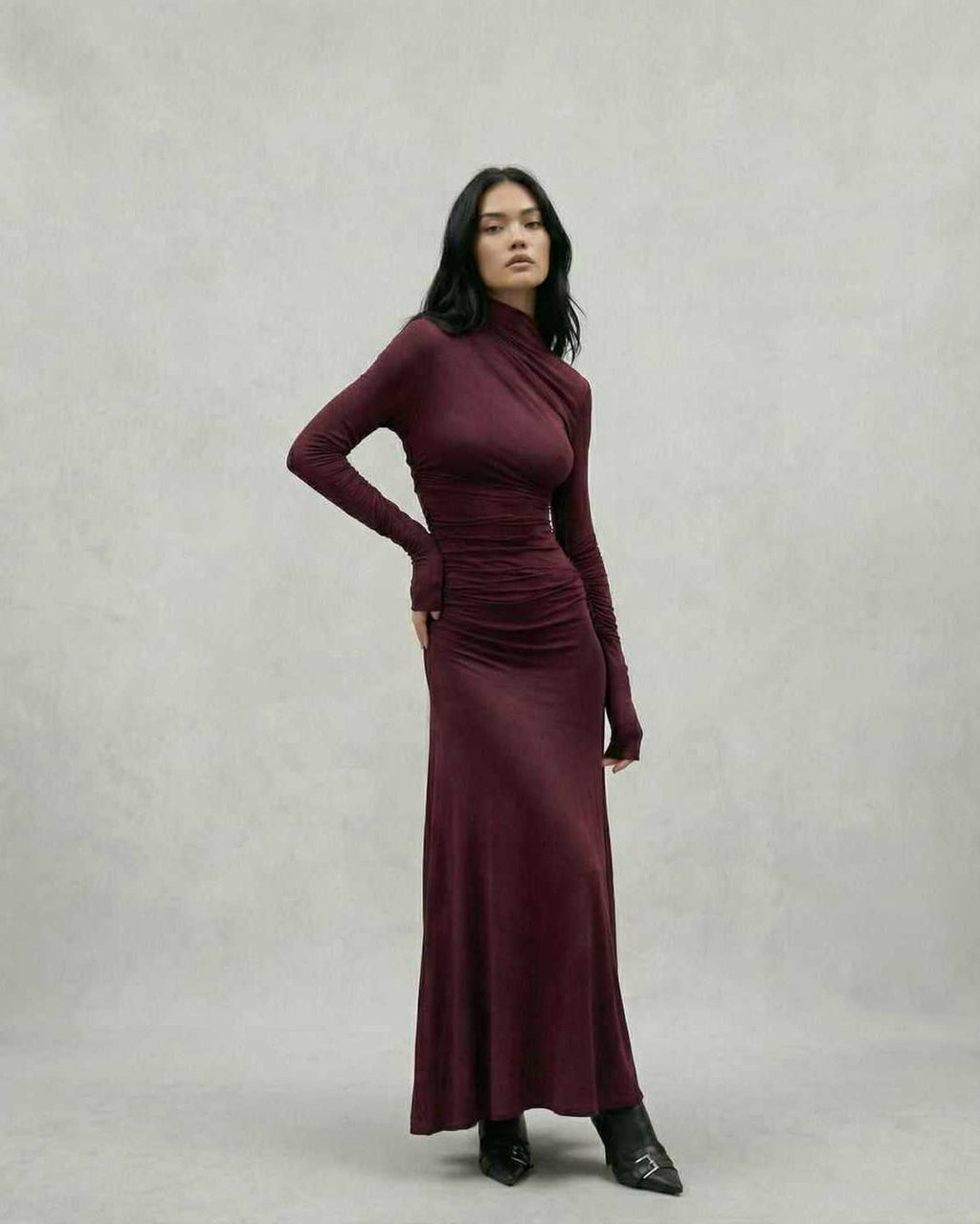 Elegant model wearing the Celeste Maxi Dress in burgundy, showcasing a sheath silhouette by Lauven.