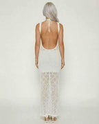 Celeste Maxi Dress by Lauven, showcasing intricate crochet knit and elegant tie-back design from the back view.