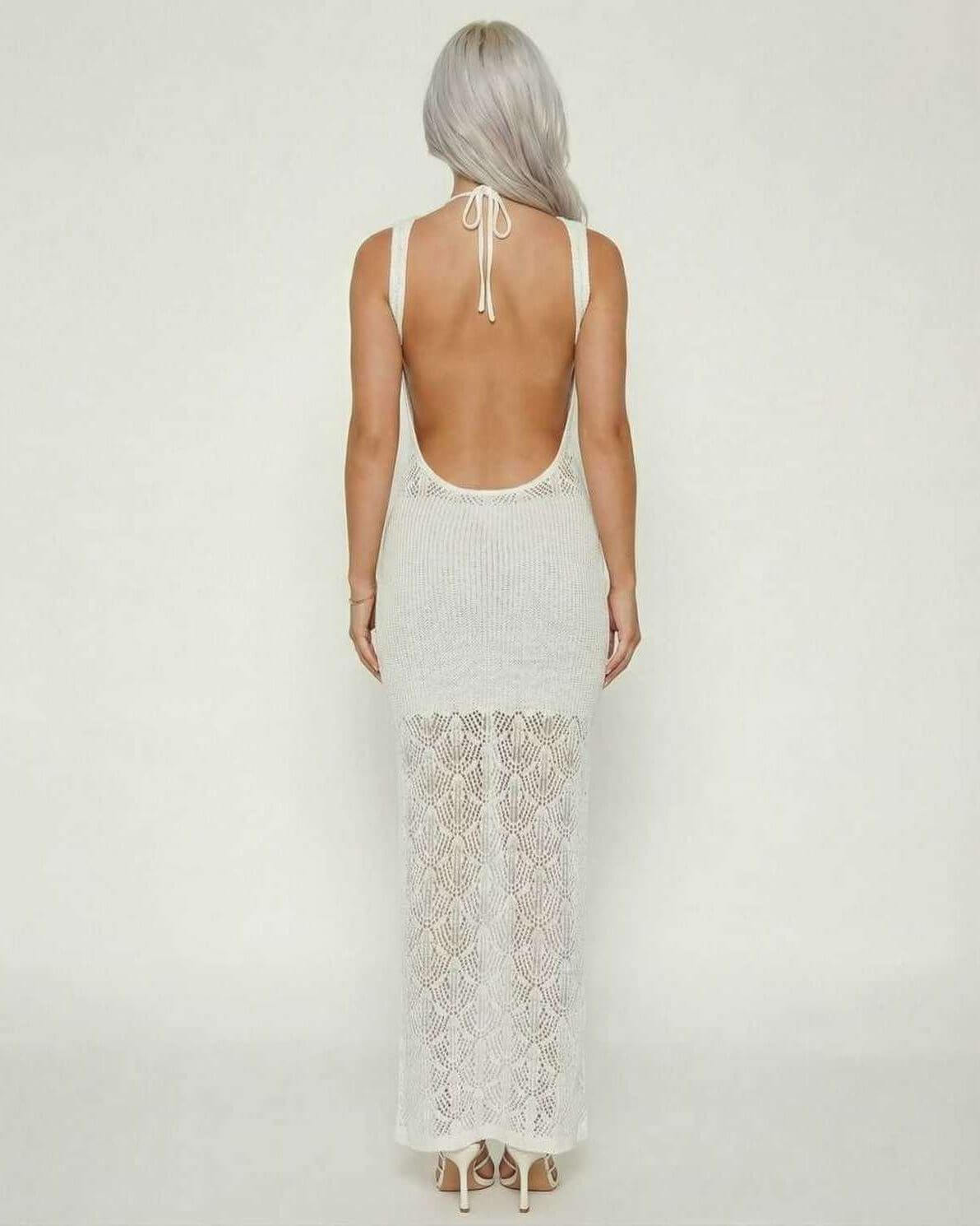 Celeste Maxi Dress by Lauven, showcasing intricate crochet knit and elegant tie-back design from the back view.