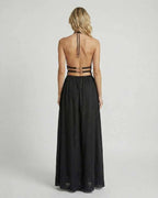 Celeste Maxi Dress by Lauven – Elegant back view showcasing the sleek black silhouette and halter neck design.