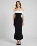 Celeste Maxi Dress by Lauven features an elegant off-shoulder silhouette in black and white, offering timeless sophistication.