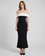 Celeste Maxi Dress by Lauven features an elegant off-shoulder silhouette in black and white, offering timeless sophistication.