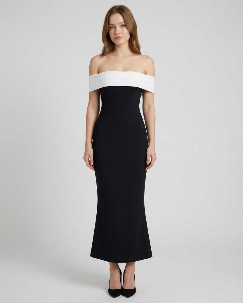 Celeste Maxi Dress by Lauven features an elegant off-shoulder silhouette in black and white, offering timeless sophistication.